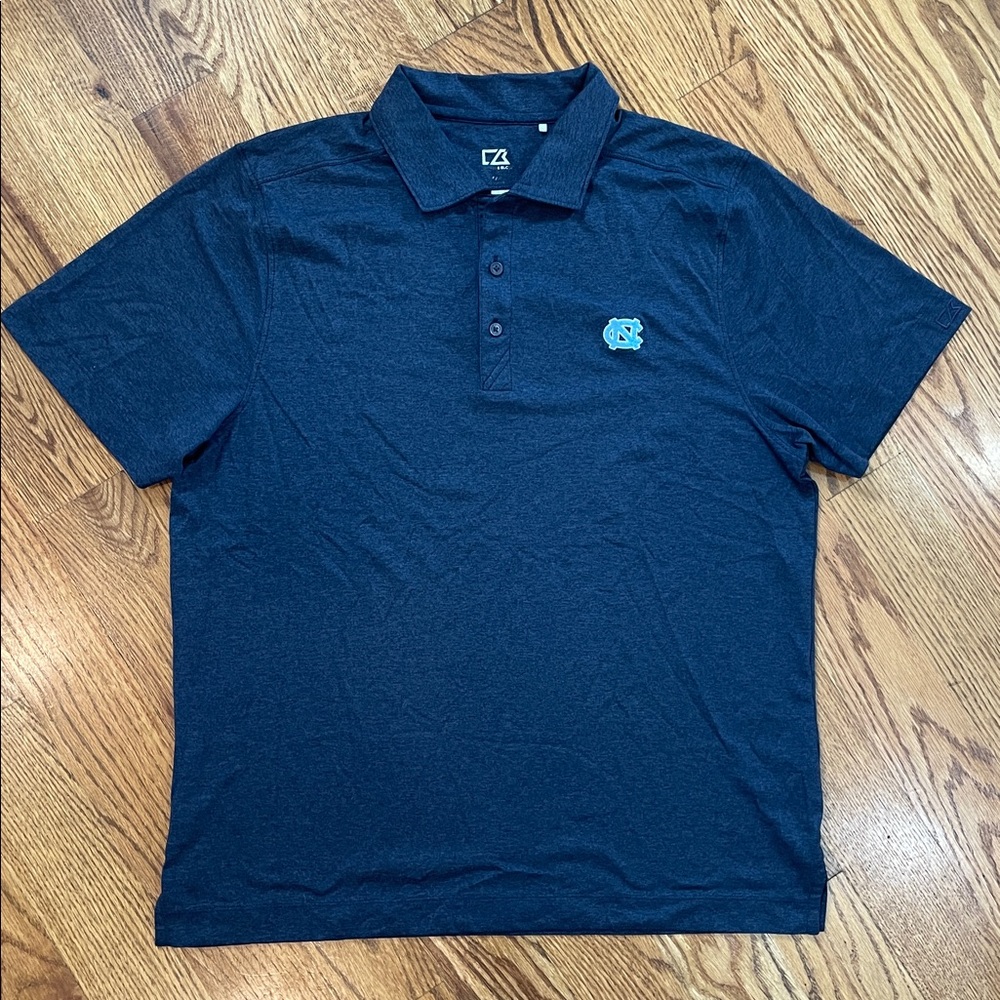 North Carolina Tar Heels Cutter & Buck Polo Shirt. Size Medium. Dark Navy Color.